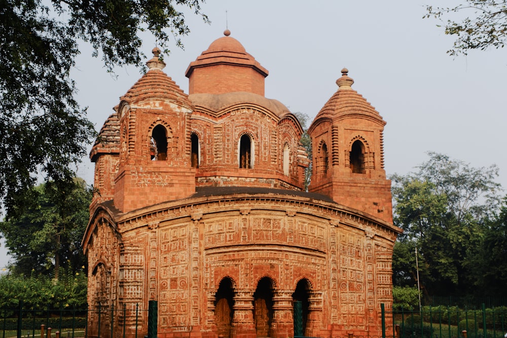 a large brick building with two towers on top of it