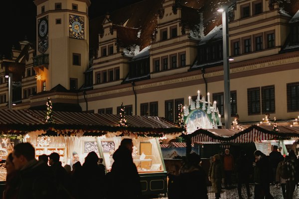 A crowd of people standing around a christmas market — Leipzig, Germany