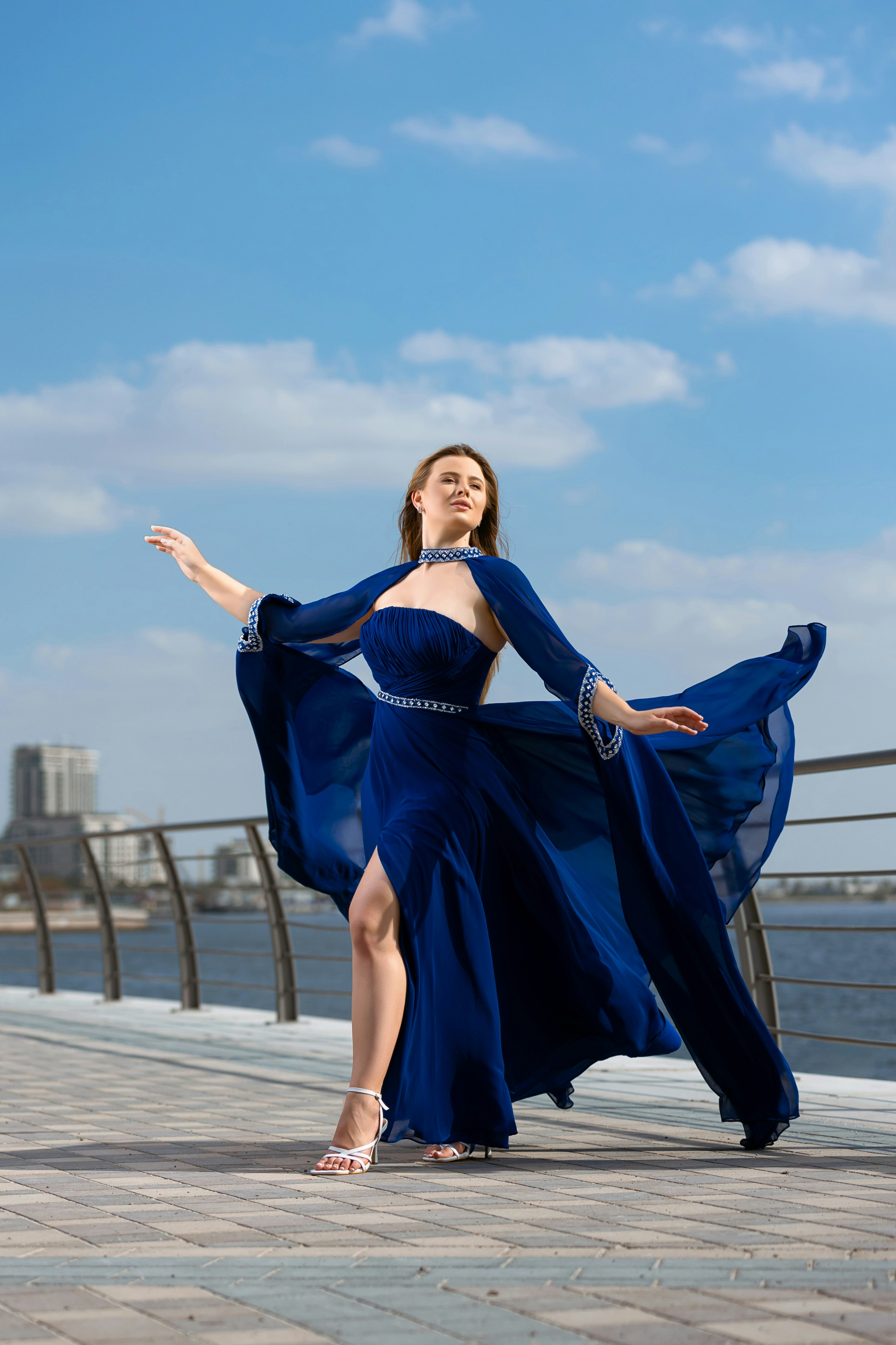 A woman in a blue dress is posing for a picture photo – Free Woman ...