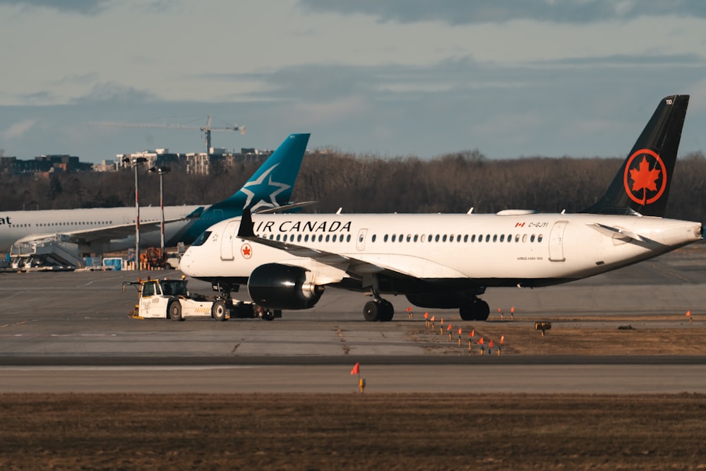 a large jetliner sitting on top of an airport tarmac