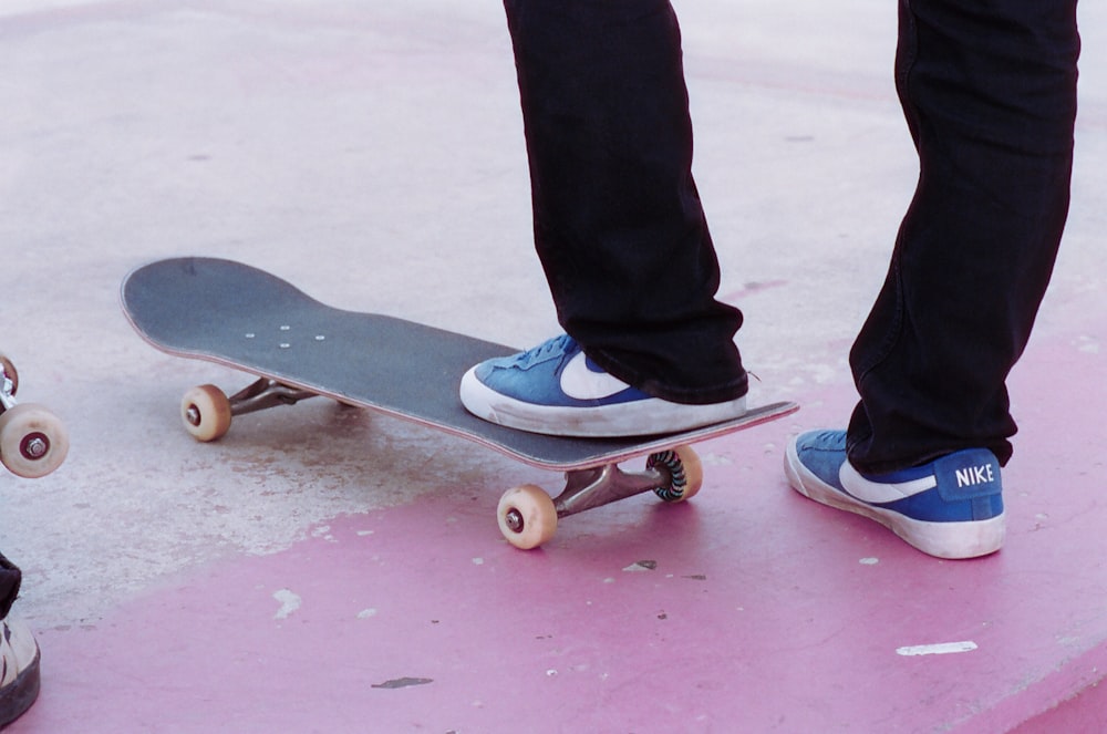 a person standing on top of a skateboard