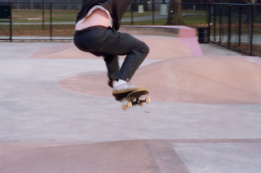 a person jumping a skate board in the air