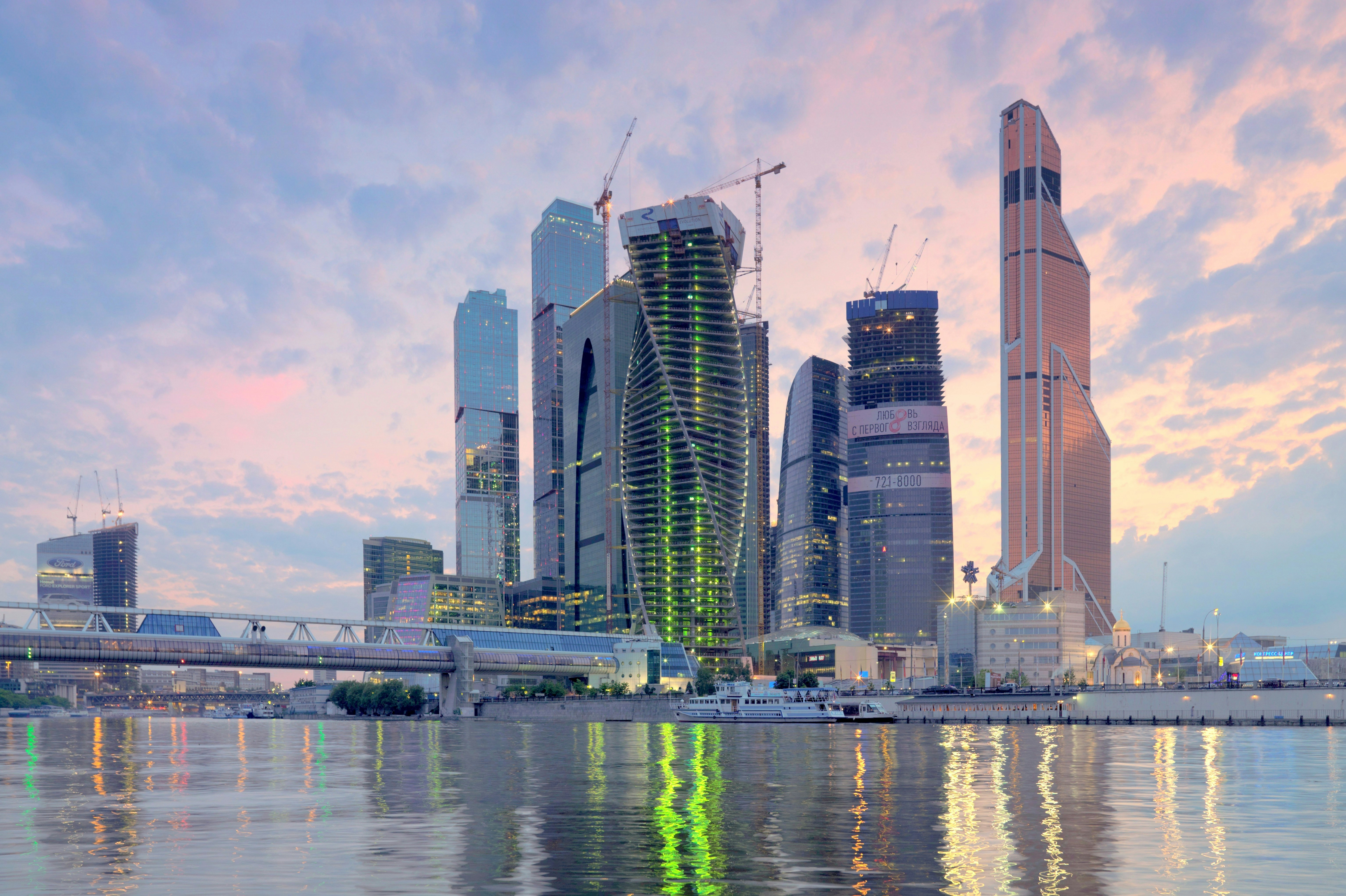 a large body of water with a city in the background