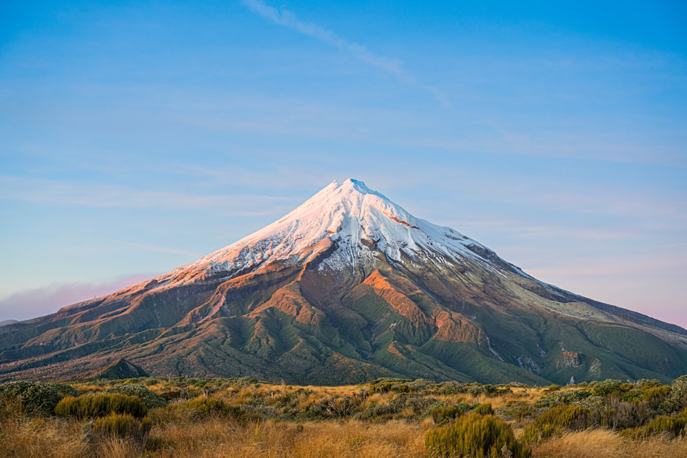 a large mountain with a snow capped top