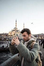 a man taking a picture with his cell phone