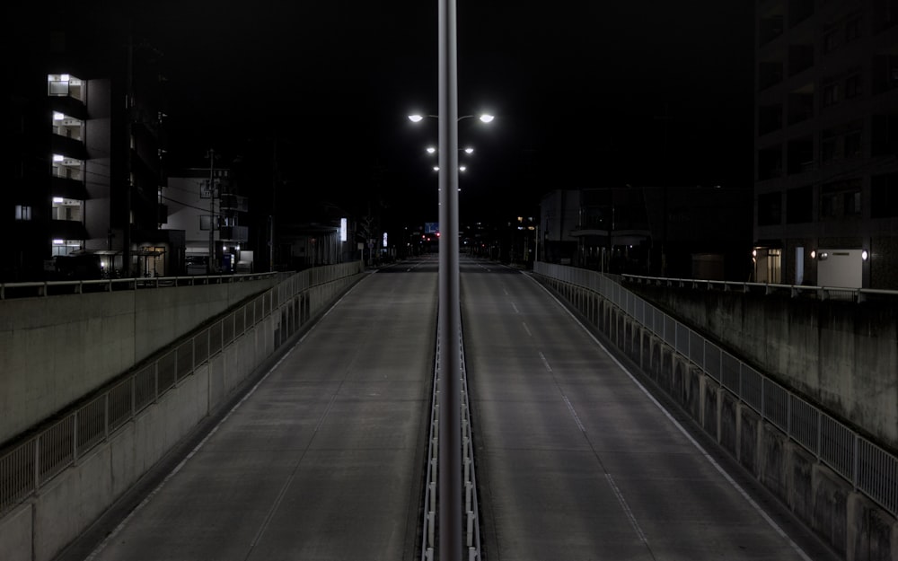 an empty street at night with street lights