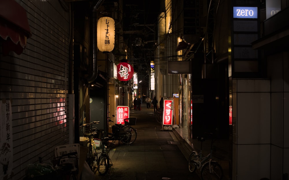 a narrow alley way with a bicycle parked on the side of it