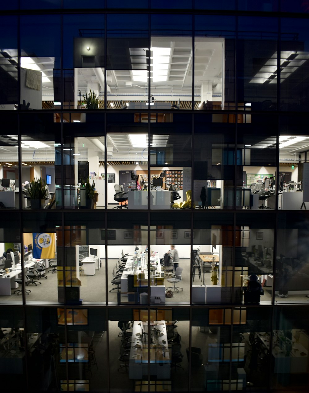 an office building is lit up at night