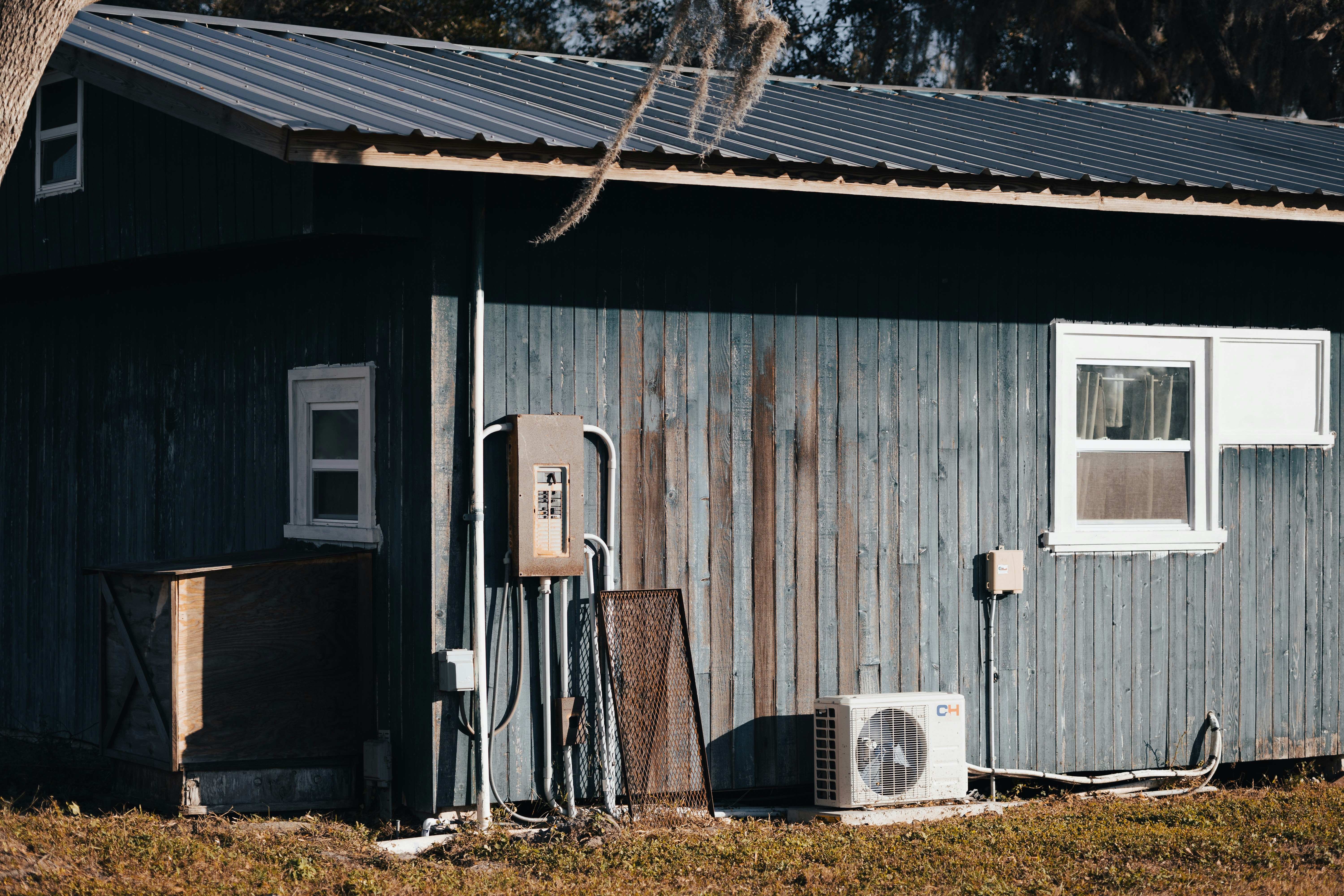 A well-maintained outdoor condenser unit in a Wichita suburb surrounded by clean landscaping