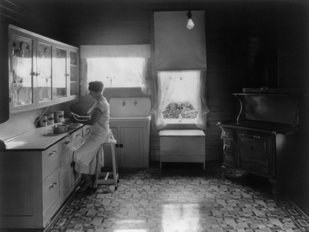 Woman working in a mid-century kitchen