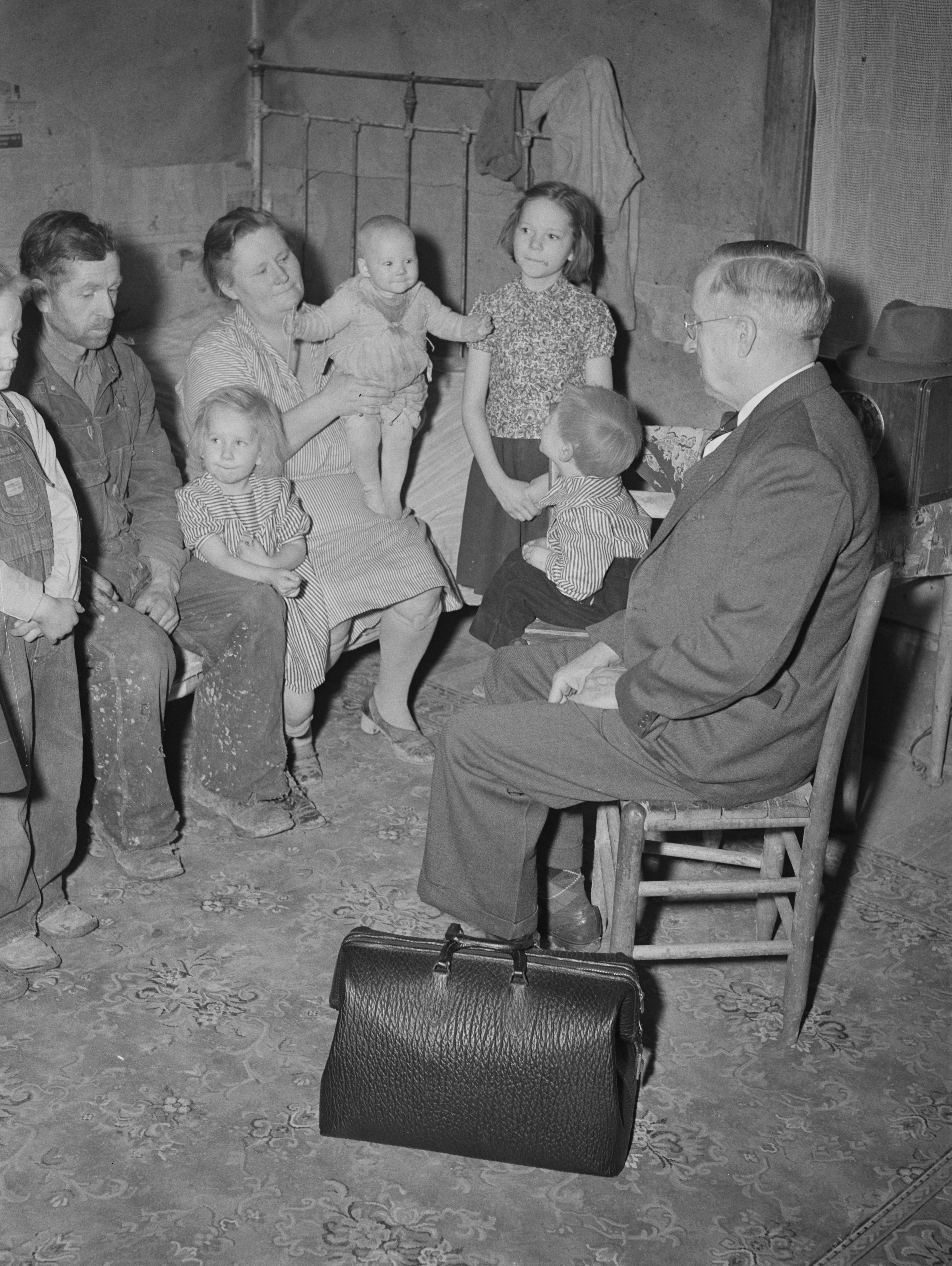 Country doctor visiting farm family