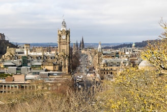 a view of a city with tall buildings and a clock tower