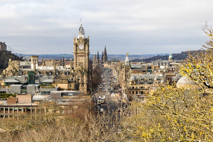 a view of a city with tall buildings and a clock tower