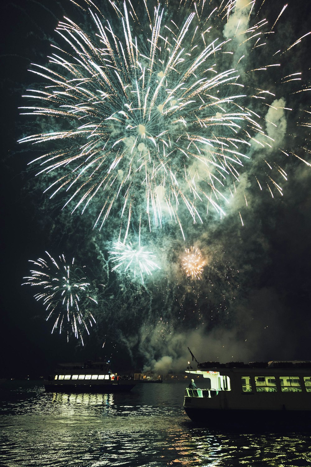 a large fireworks display over a body of water