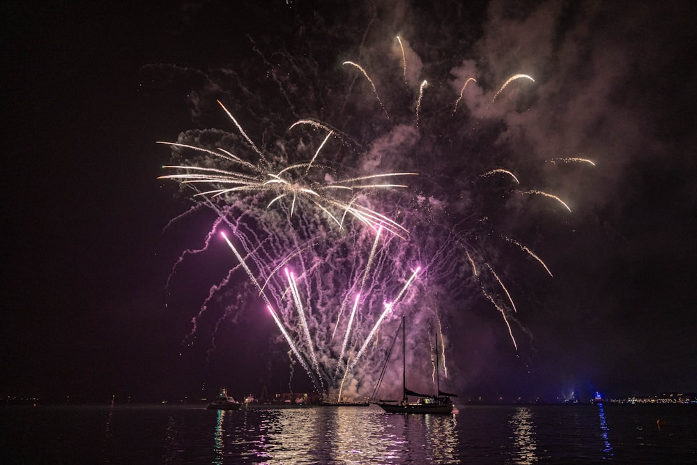 a large fireworks display over a body of water