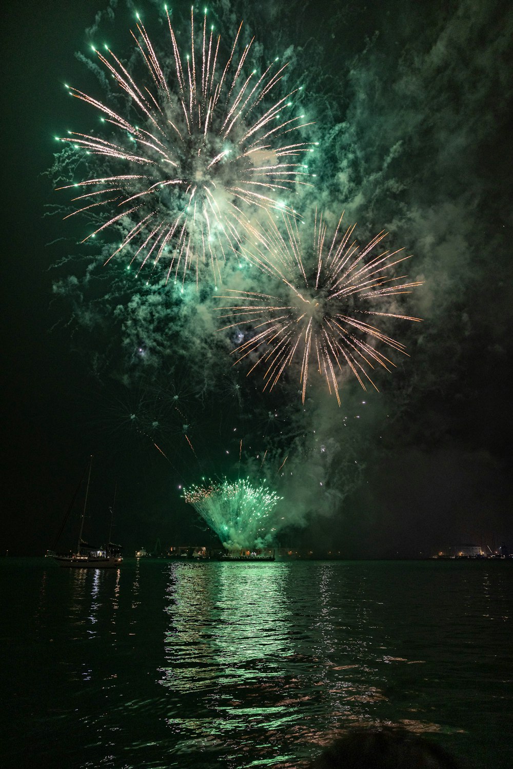 a large fireworks display over a body of water