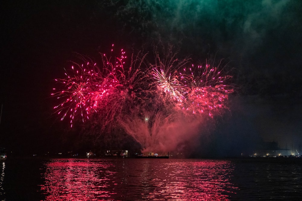 a large fireworks display over a body of water