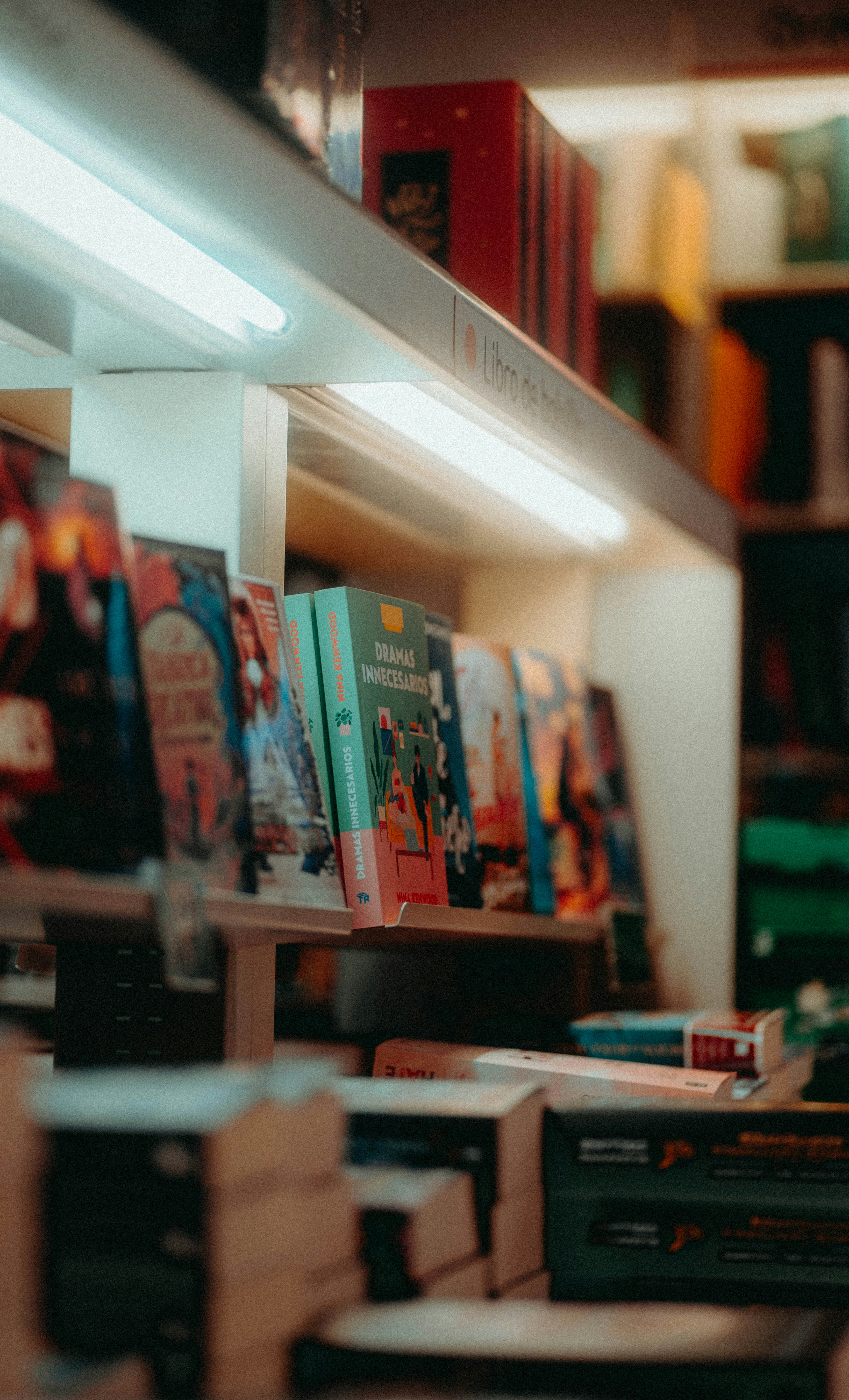 a row of books sitting on top of a shelf