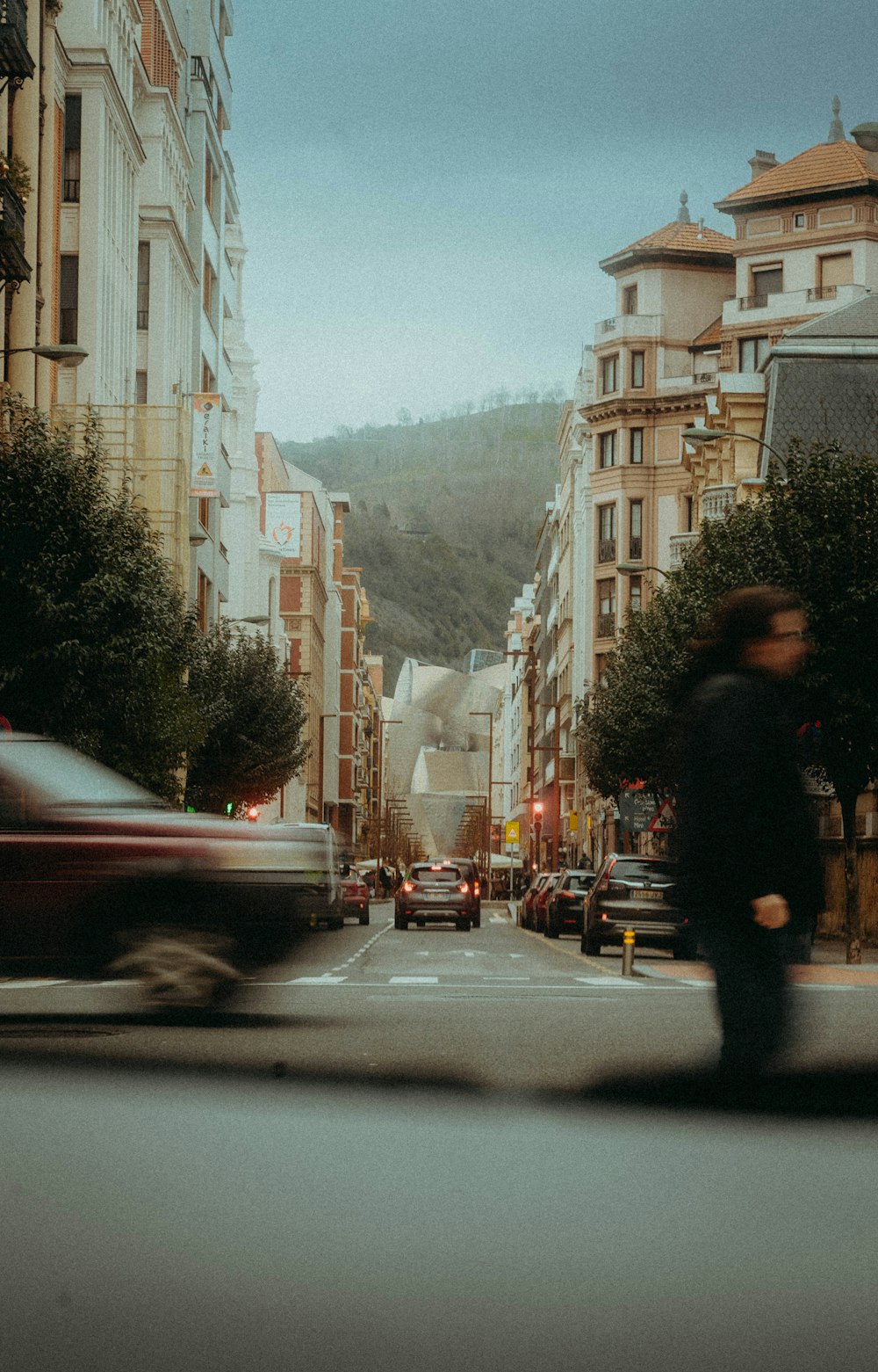 a blurry photo of a man walking down a street