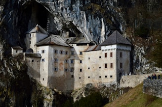 a castle built into the side of a mountain