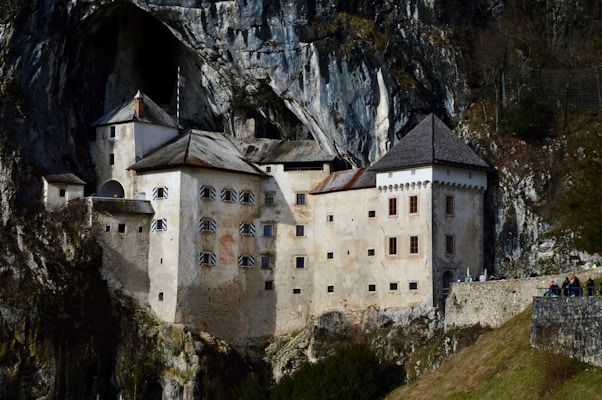 a castle built into the side of a mountain