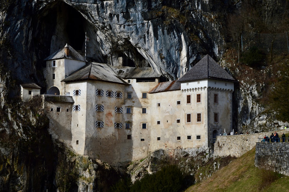 a castle built into the side of a mountain