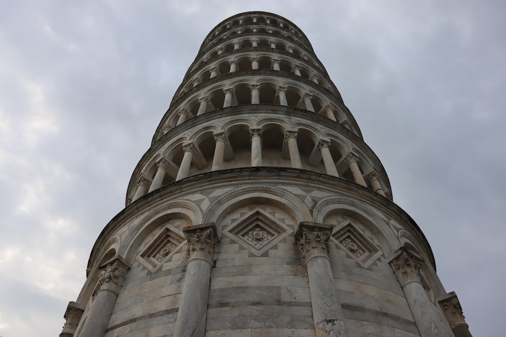 a very tall tower with a clock on it's side