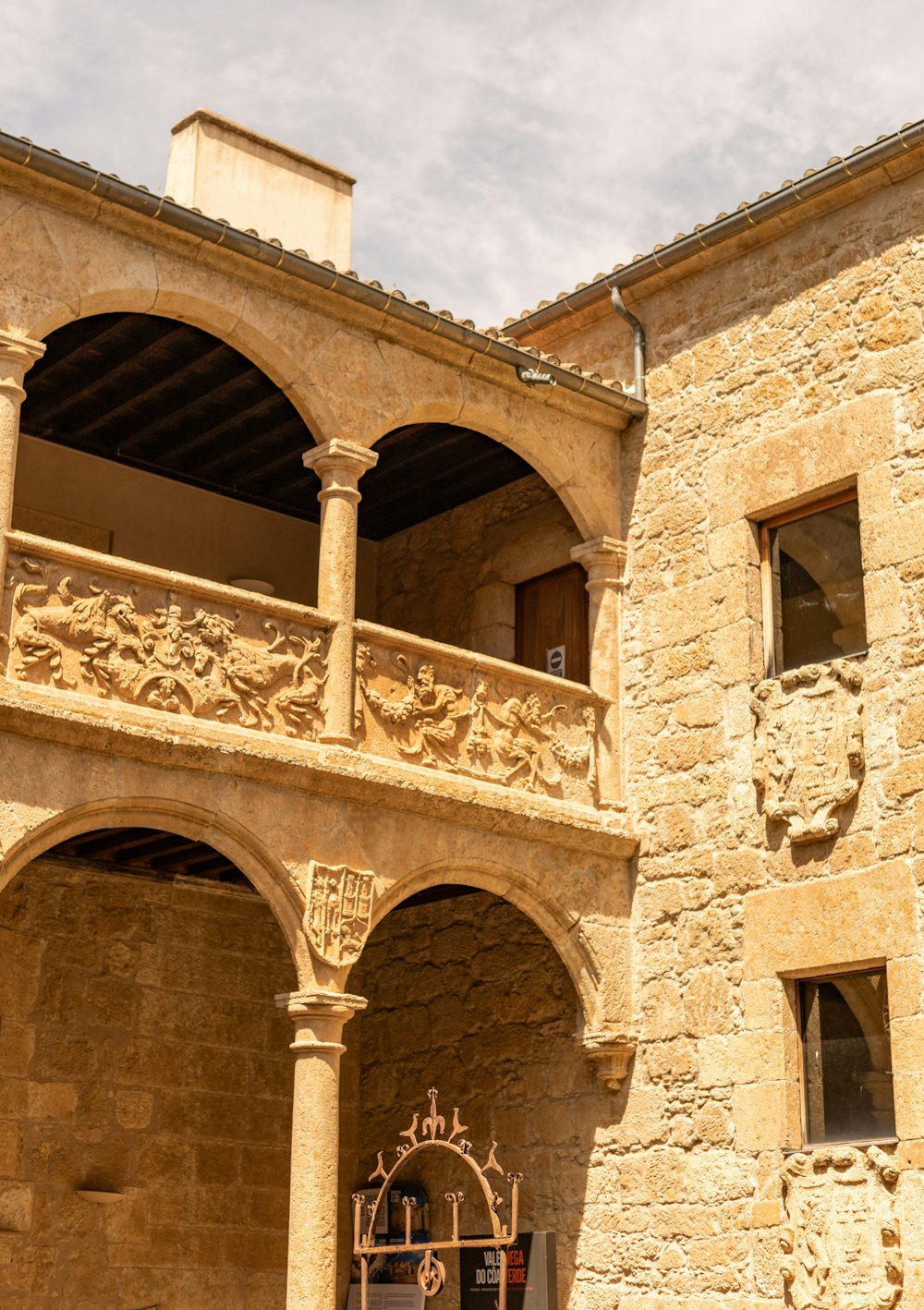 a stone building with a clock on the front of it