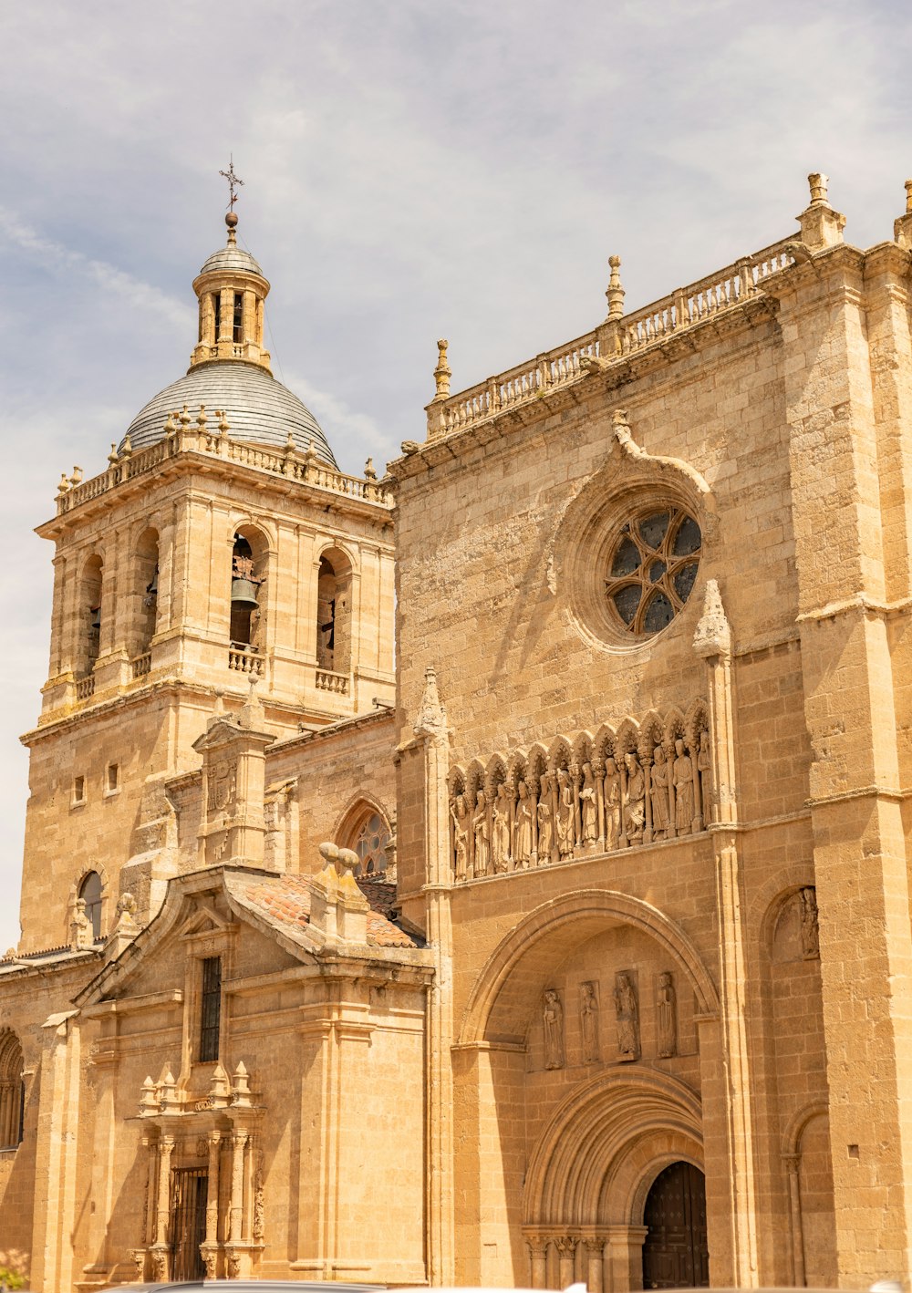 a large cathedral with a clock on the front of it