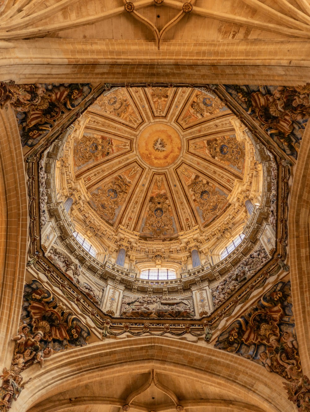 the ceiling of a large building with a dome