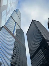 a couple of tall buildings sitting next to each other