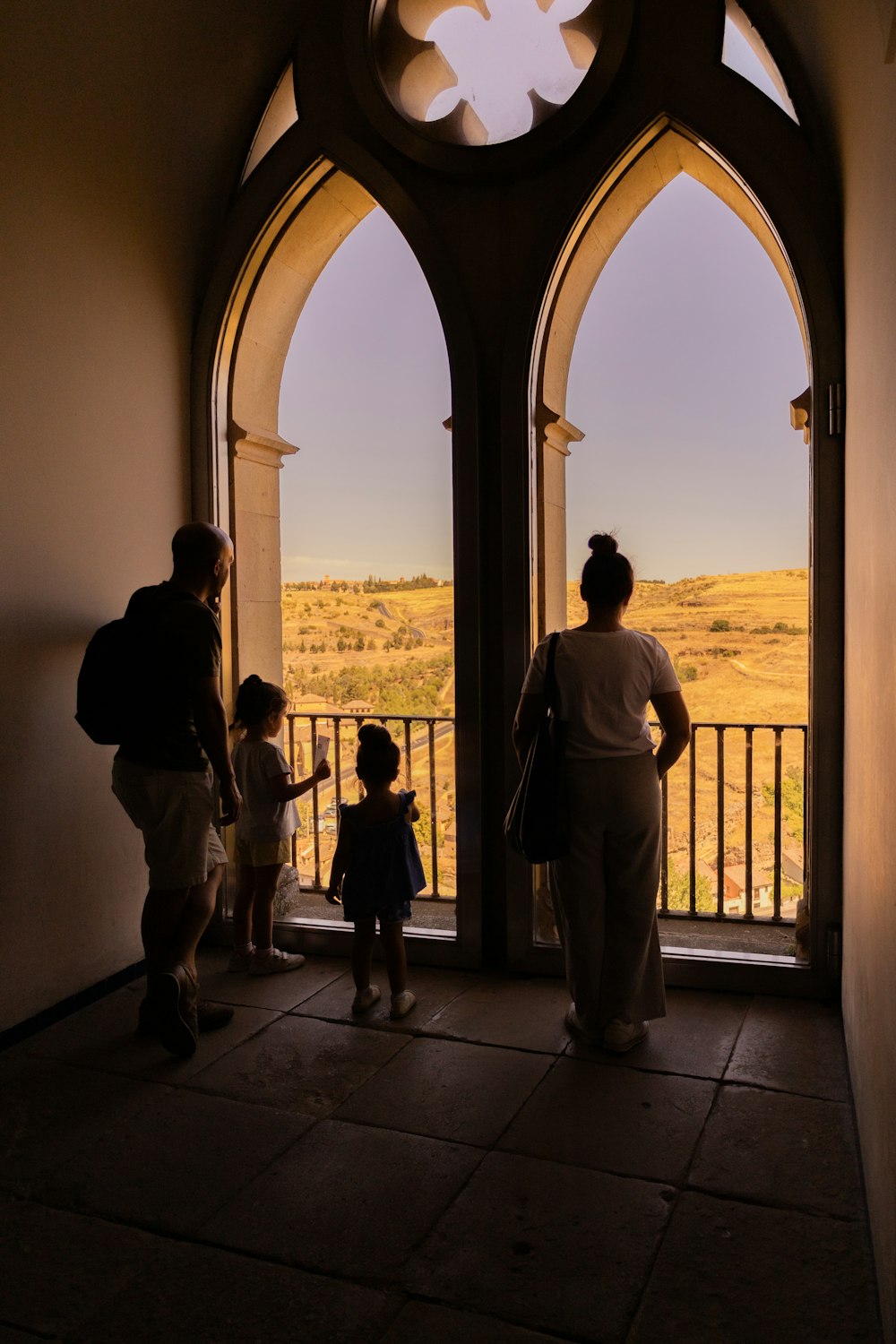 a group of people standing in front of a window