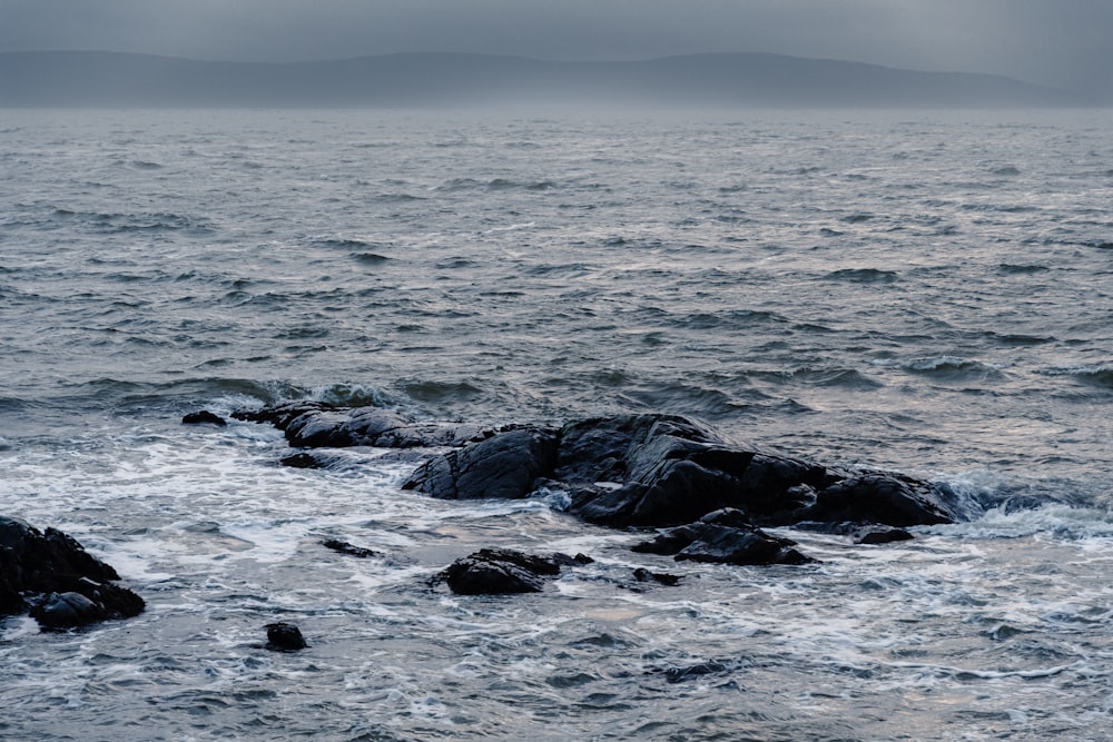 a large body of water surrounded by rocks