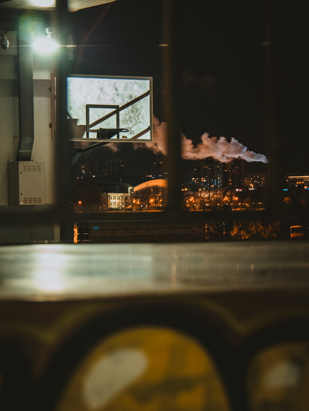 a view of a city at night through a window
