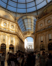 a group of people standing inside of a building