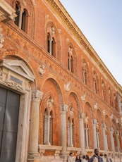 a group of people standing in front of a building