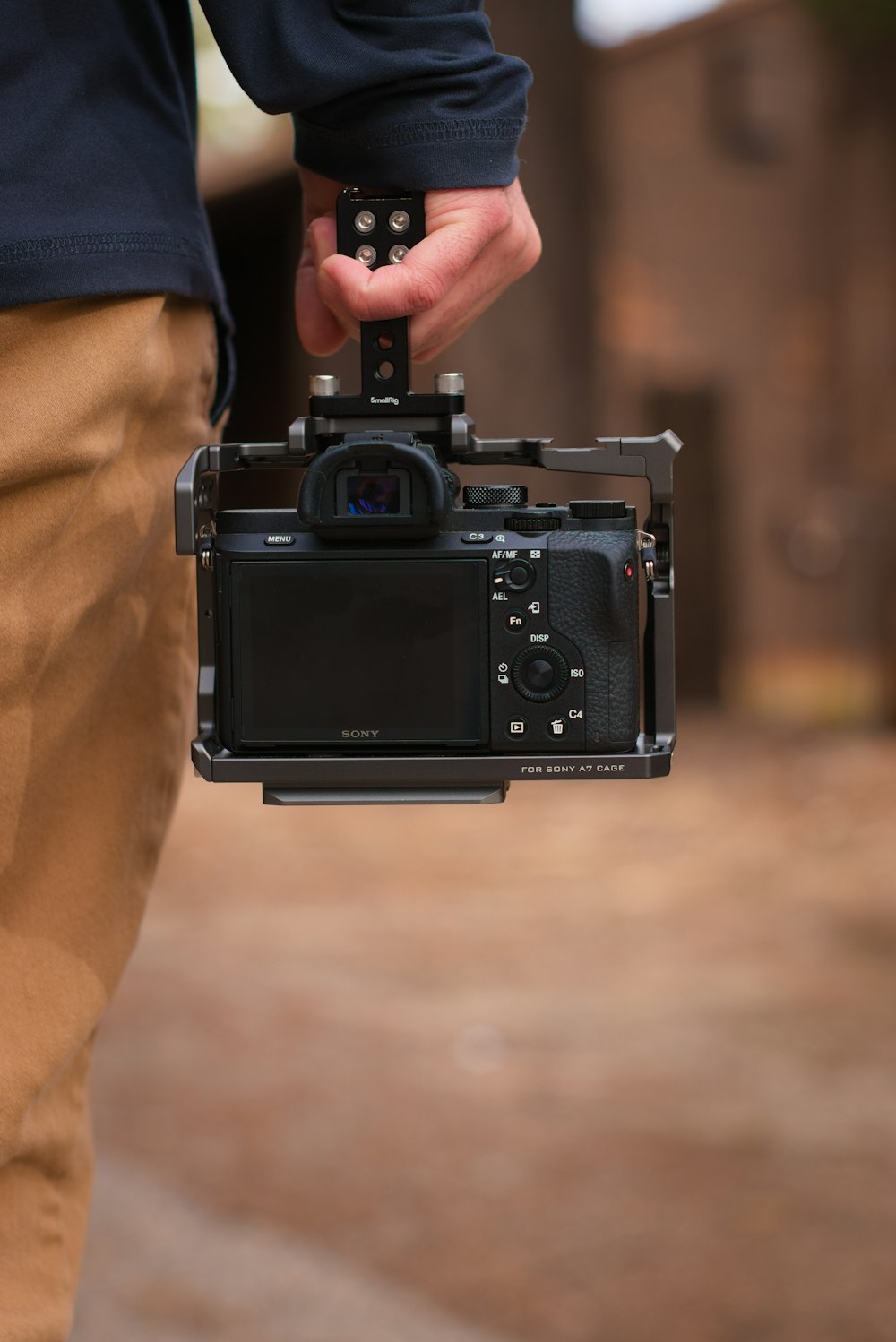 a person holding a camera in their hand