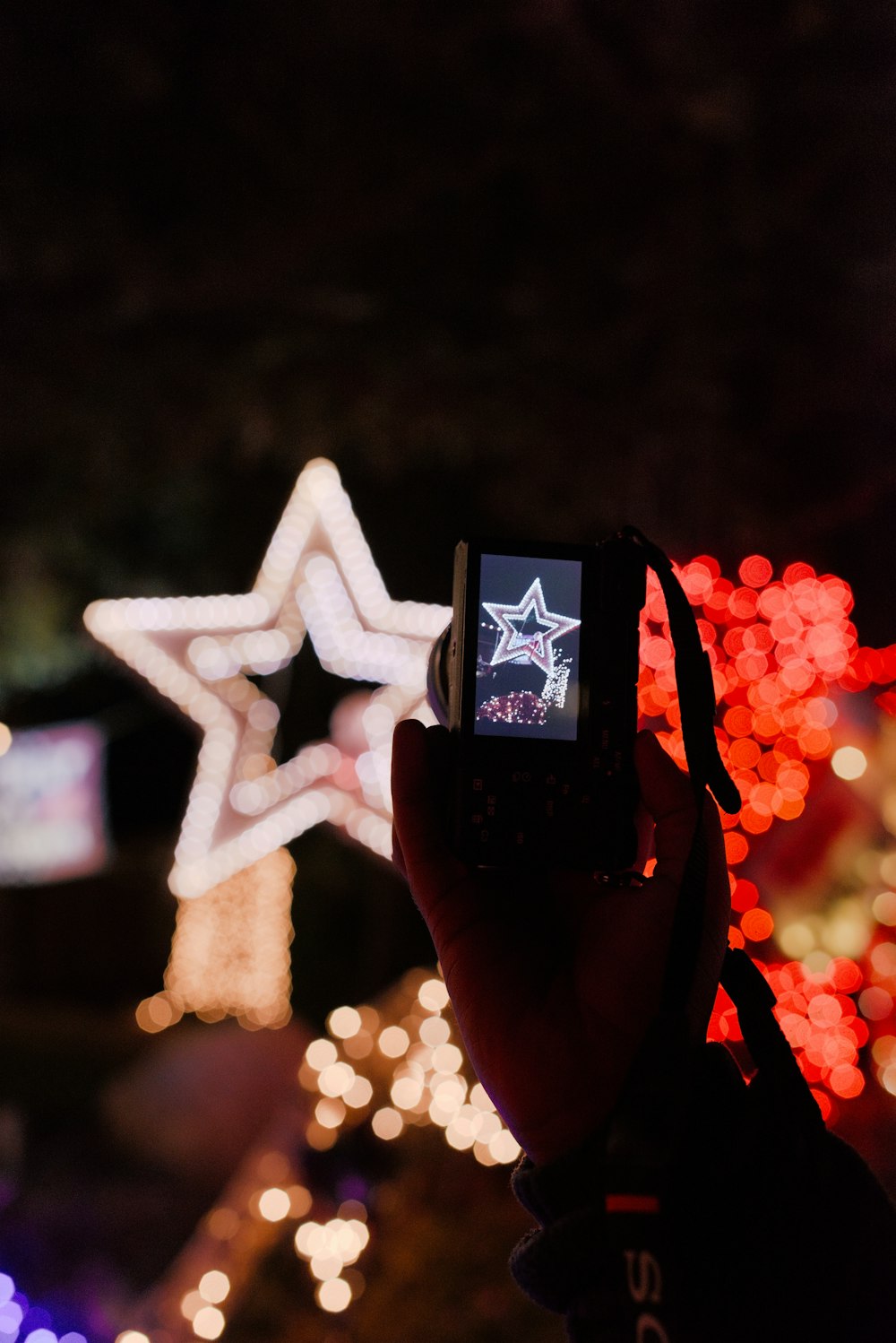 a person taking a picture of a star with a cell phone