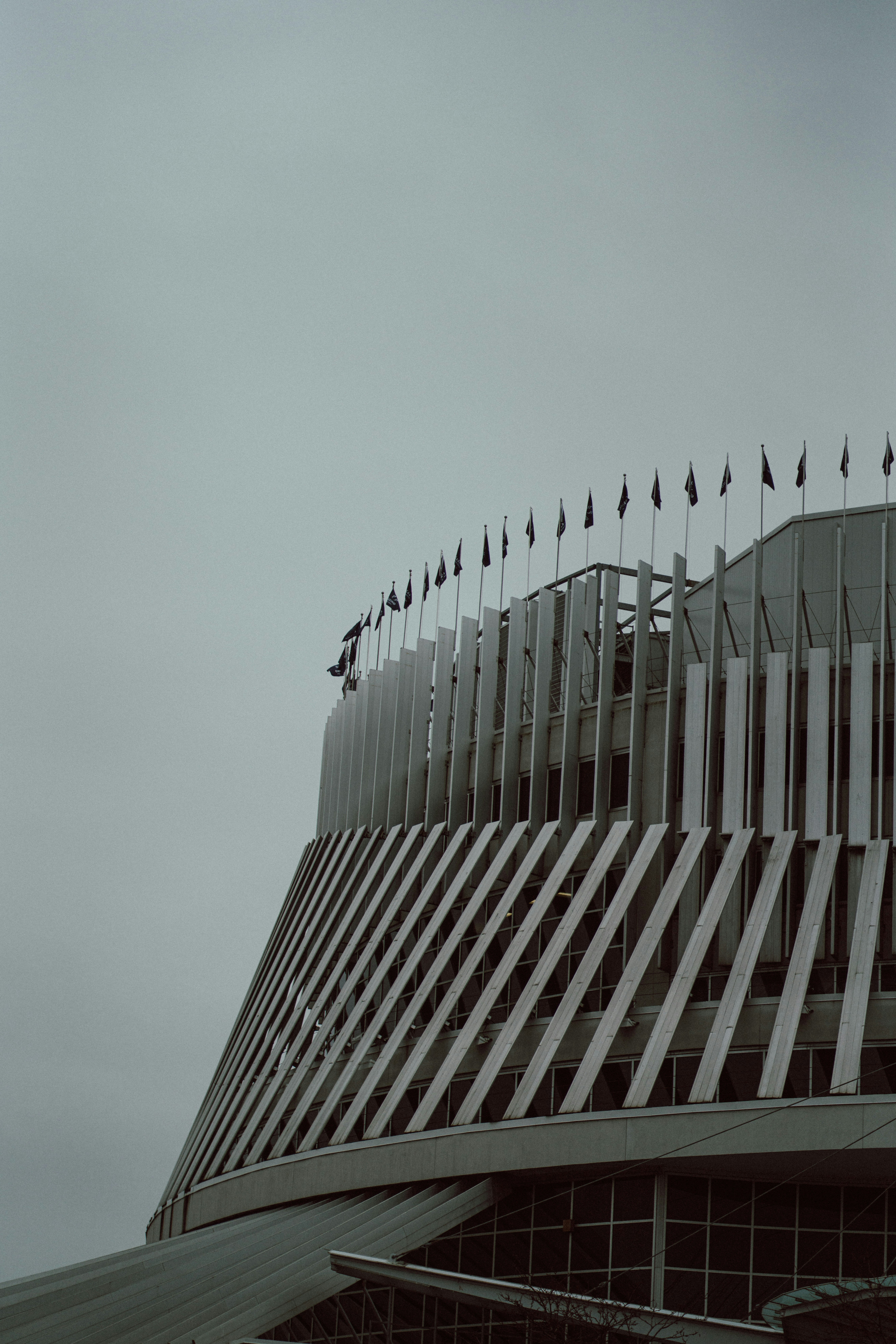 A building with a lot of flags on top of it photo – Free City Image on ...