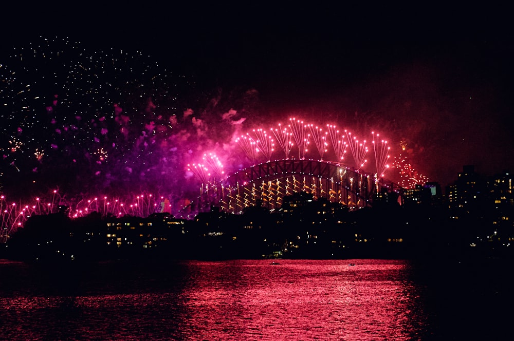 a large fireworks display over a city at night