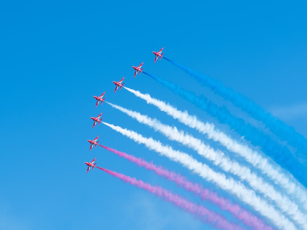 a group of airplanes flying in formation in the sky