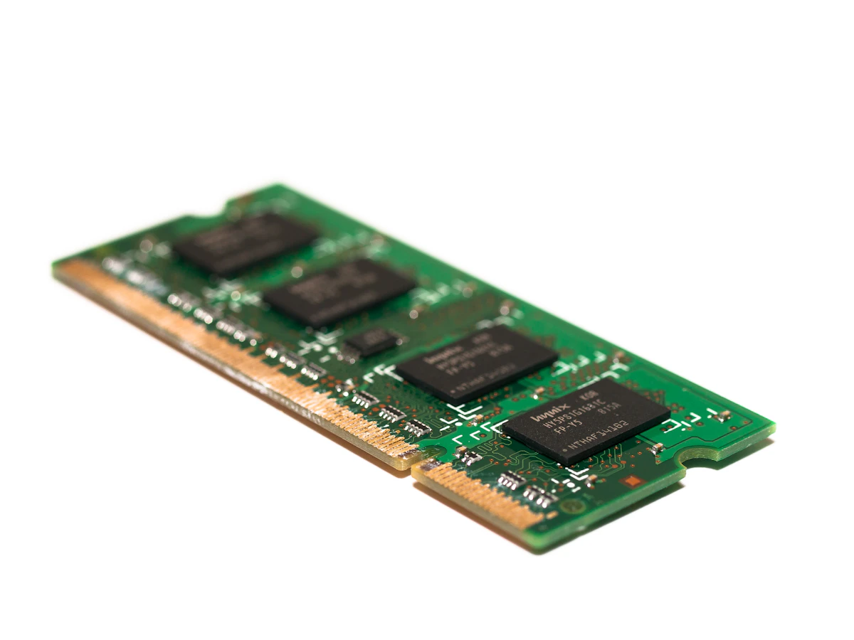 Close-up macro photograph of a computer memory chip and its gold contacts