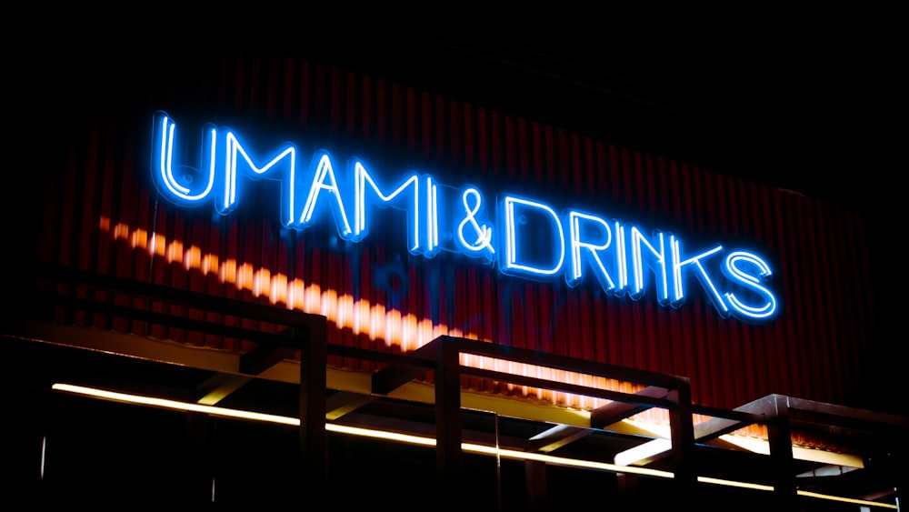 a neon sign that reads umami & drinks