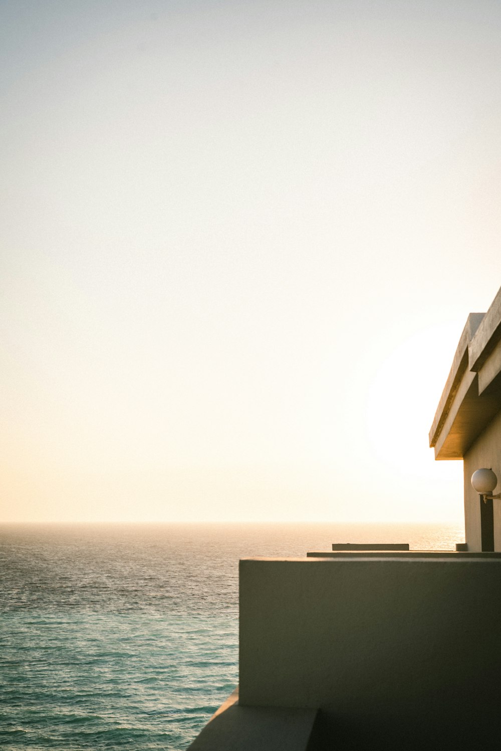 a view of the ocean from a roof of a building