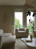 a living room filled with furniture and a large window