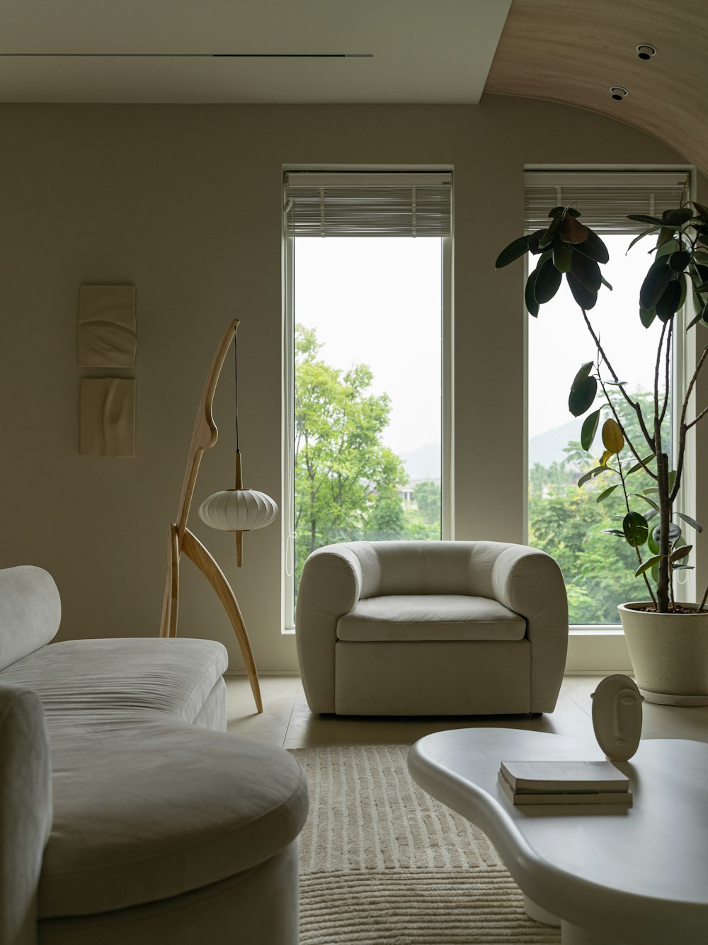 a living room filled with furniture and a large window