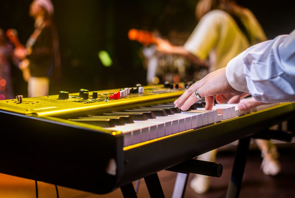 a close up of a person playing a keyboard