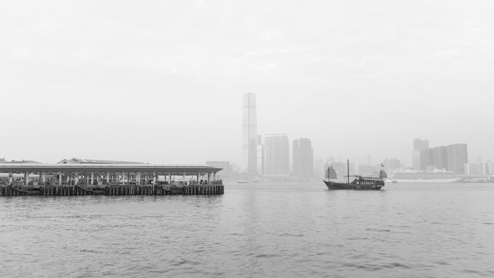 a black and white photo of a boat in the water