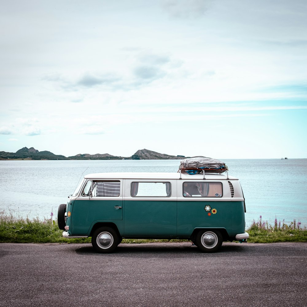 a van parked on the side of a road near the ocean