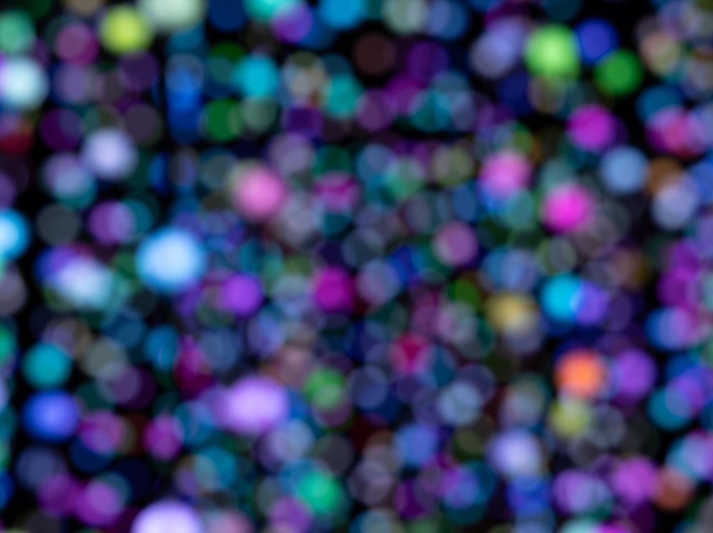 a blurry photo of a bunch of different colored dots